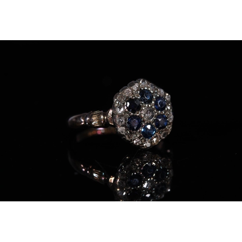 156 - Antique yellow metal diamond and sapphire cluster ring, the stones formed in the shape of a flower h... 