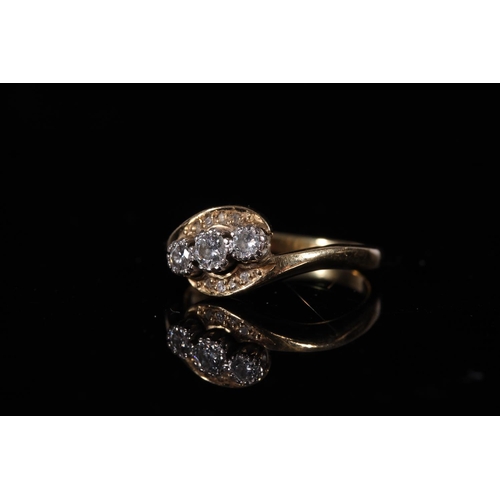 161 - 18ct gold diamond three stone ring in crossover setting, the stones approx. 0.1ct each, size R, 5g.