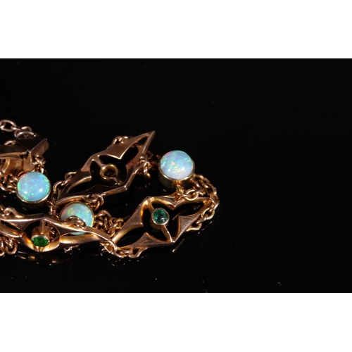 162 - 15ct gold bracelet set with opals and emeralds, 10g gross.