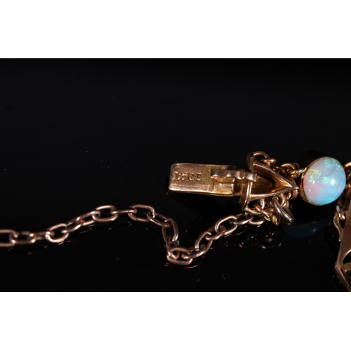 162 - 15ct gold bracelet set with opals and emeralds, 10g gross.