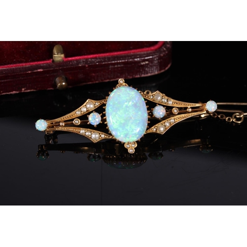 163 - Unmarked yellow gold opal and seed pearl bar brooch in the Victorian style, the large oval opal appr... 