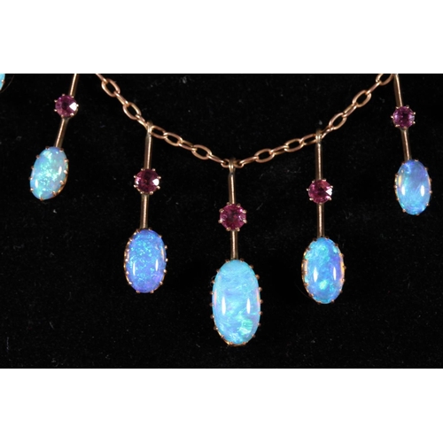 164 - 9ct gold opal and ruby pendant necklace having a fringe of eleven graduated suspended stones, 5.8g g... 