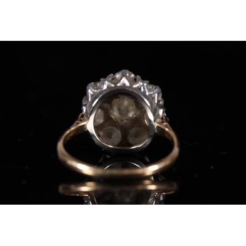 165 - Large diamond cluster ring of flower head form, the central 1.0ct stone encircled by seven 0.15-0.2c... 