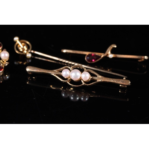 182 - Three Edwardian 9ct gold gem set bar brooches together with a 9ct gold mounted stick pin, gross 9.0g... 