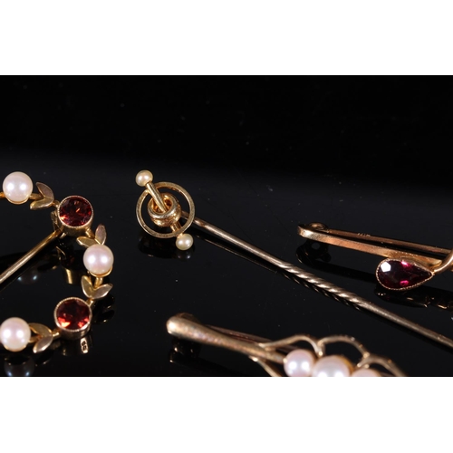 182 - Three Edwardian 9ct gold gem set bar brooches together with a 9ct gold mounted stick pin, gross 9.0g... 