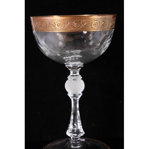 303 - Venetian wine glass, early 20th century, the tapered lattimo threaded bowl over a wrythen aventurine... 