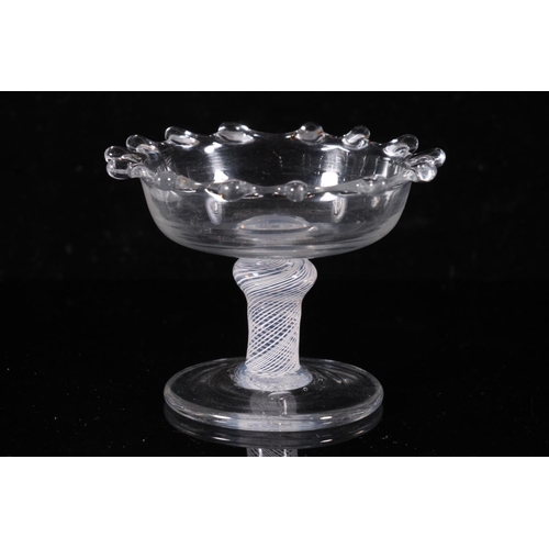 304 - George III period glass sweetmeat dish, c1760, the dentil rim shallow bowl on a shoulder knopped ste... 