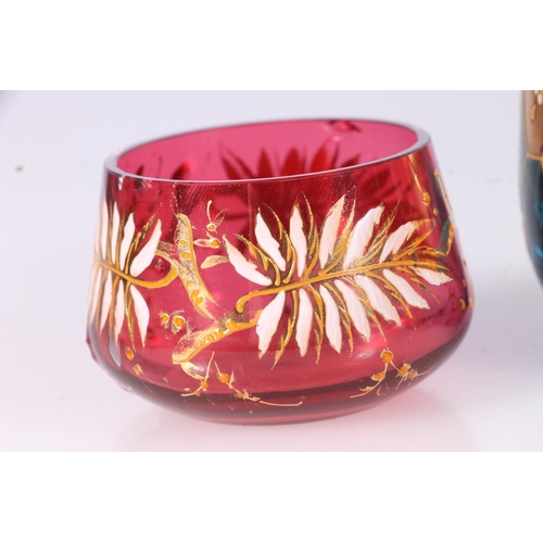 305 - Bohemian miniature cranberry glass bowl and similar cup in the manner of Moser, decorated in white a... 