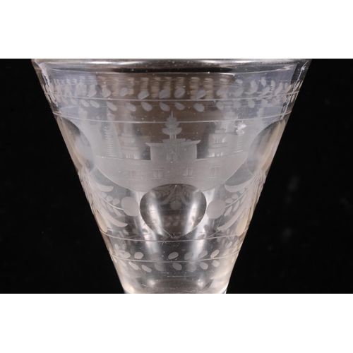 308 - 18th century continental wine glass, the funnel bowl wheel engraved with foliate forms and windowed ... 