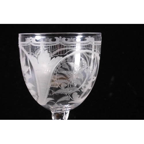 309 - Victorian large wine glass, the bowl finely engraved with scrolling ferns under a stringed border, o... 