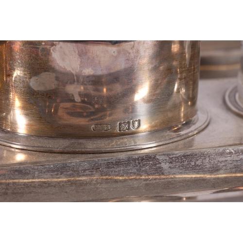 68 - Edward VII silver and glass desk stand, the rectangular tray with moulded edges on four scrolled fee... 