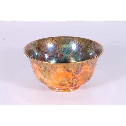 316 - Wedgwood Fairyland Lustre small bowl, c1920s, the mottled orange glazed exterior with gilt butterfly... 