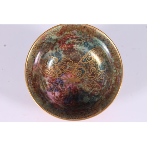 316 - Wedgwood Fairyland Lustre small bowl, c1920s, the mottled orange glazed exterior with gilt butterfly... 