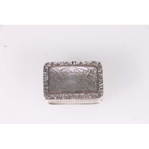 85 - Victorian silver vinaigrette, the hinged lid with foliate repousse border and plain central cartouch... 