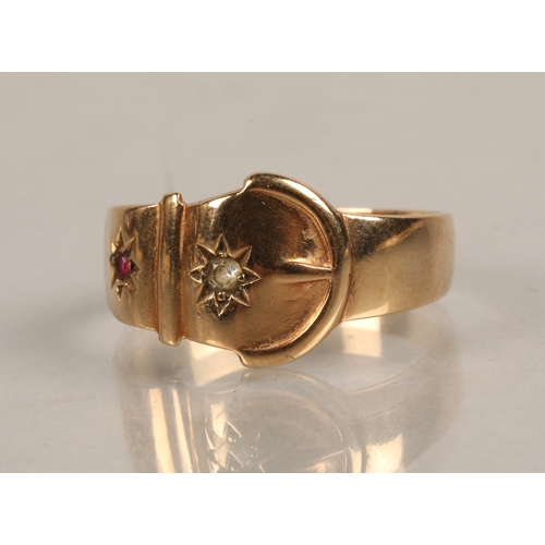 193 - 9ct gold buckle ring set with a pink gem and a white gem, ring size W, 4g