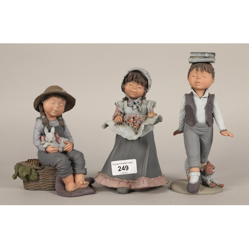 249 - Three Spanish Elisa figures to include girl with rabbit Ltd 3057/5000 also girl walking with books L... 