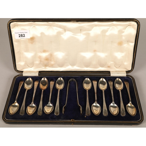 282 - Twelve George V teaspoons & tongs, Sheffield 1921, Watson & Gillott, cased148 grams