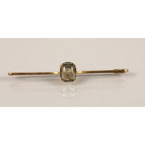 37 - 15ct gold bar brooch set with a pale blue stone, 3.4g