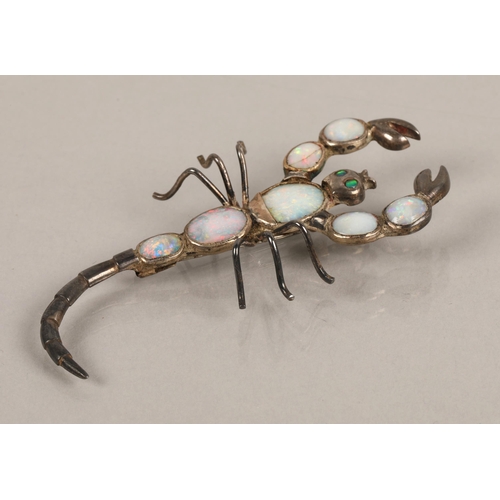 48 - White metal scorpion brooch set with opals, 10g