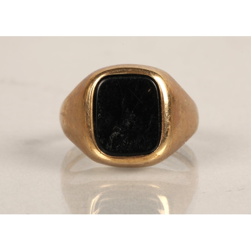 66 - 9ct gold signet set with a black gem, ring size P, 4.1g