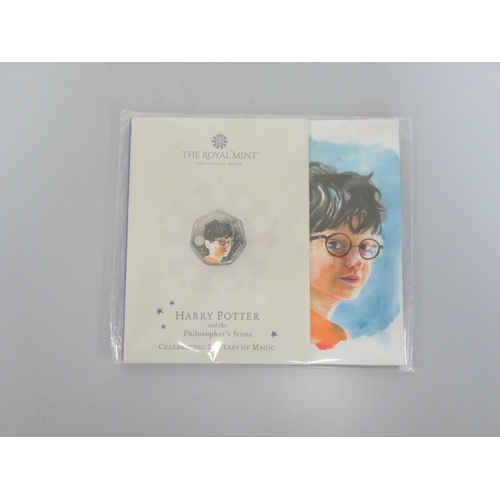 271 - United Kingdom. Royal Mint coin sets to include three carded and sealed BU Harry Potter 25 Years of ... 