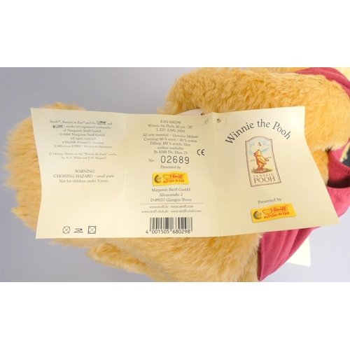 60 - Steiff. Winnie the Pooh Teddy Bear, 2004, white tag 680298, in yellow mohair with red waistcoat. Com... 