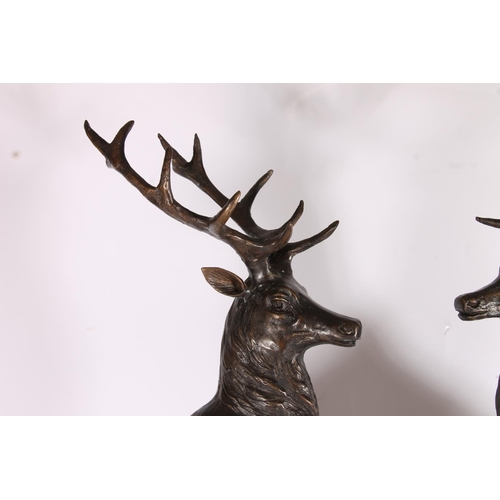 285 - After Jules Moigniez (French 1835-1894), a pair of hollow cast bronze stags on rocks, on variegated ... 