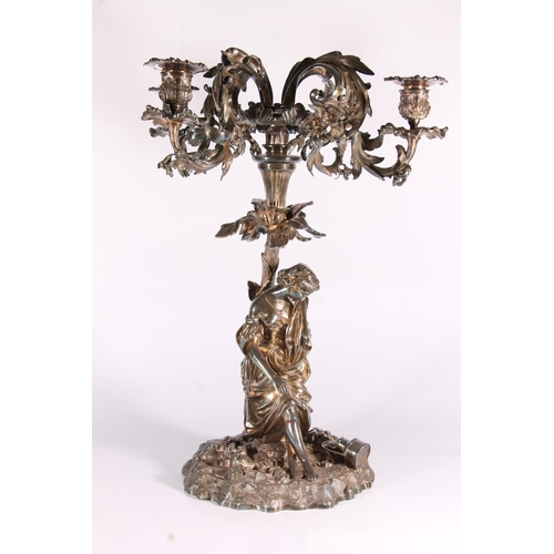 286 - Silver plated four branch figural candelabra centrepiece in a  Rococo design, the scrolling leaf and... 