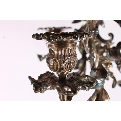 286 - Silver plated four branch figural candelabra centrepiece in a  Rococo design, the scrolling leaf and... 