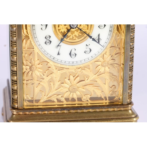 291 - French brass carriage clock, early 20th century, the corniche case around a fretwork slip, cream ena... 