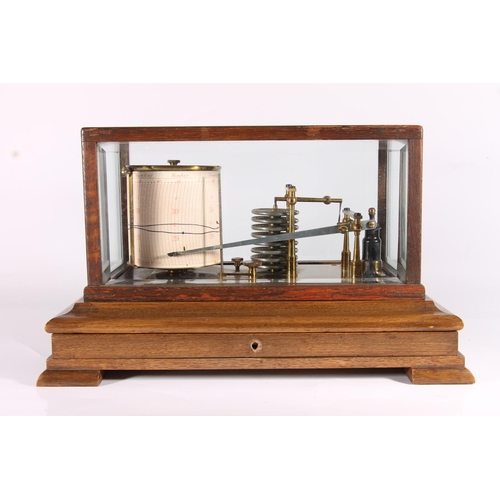 299 - Edwardian oak cased barograph, c1910, the glazed case over single drawer on bracket feet, H22cm.