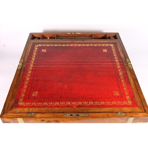 300 - Victorian walnut and brass bound writing slope, opening to reveal red leather skiver with gilt borde... 