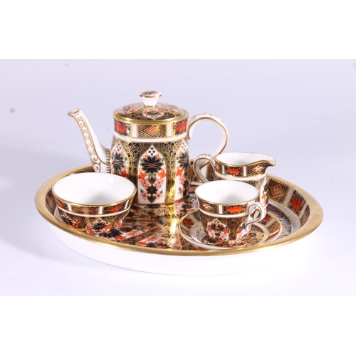 327 - Royal Crown Derby Imari pattern 1128 miniature teaset, consisting of service tray, teapot, milk jug,... 