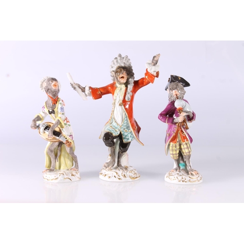 329 - Three Meissen porcelain monkey orchestra figurines, 20th century, consisting of the Conductor and tw... 