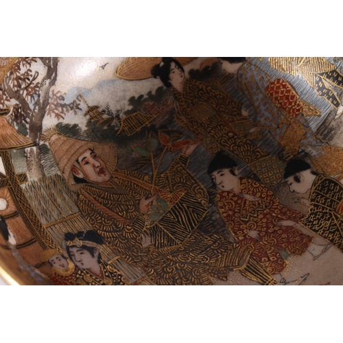 338 - Japanese Satsuma pottery bowl, late Meiji period, decorated with a village showman and children by a... 