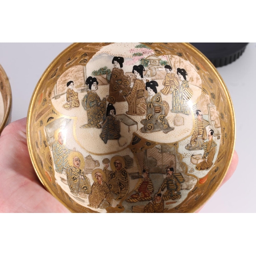 338 - Japanese Satsuma pottery bowl, late Meiji period, decorated with a village showman and children by a... 