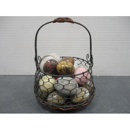 104 - Quantity of assorted mineral egg ornaments, two display cases containing Fabergé-style egg or... 