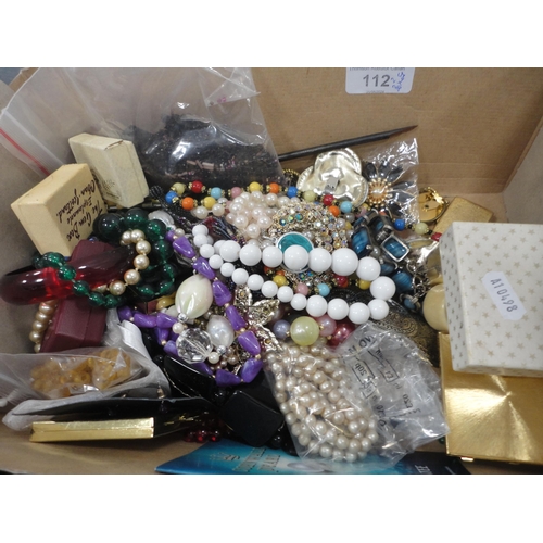 112 - Two boxes of assorted costume jewellery to include bead necklaces, brooches etc.