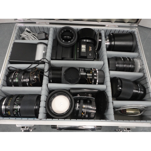 116 - Attaché case containing various camera lenses and accessories to include a Tamron lens, light... 
