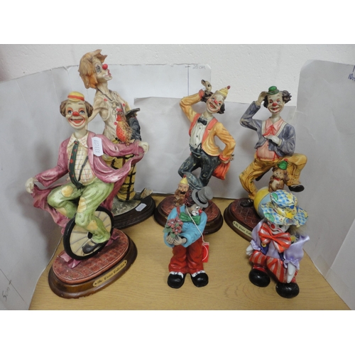 12 - Figures of clowns from the Crosa collection and Bradford Exchange musical boxes in the form of Faber... 