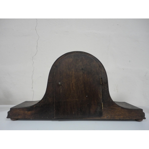 121 - Edwardian inlaid mahogany shaped mantel clock and a later oak mantel clock.  (2)