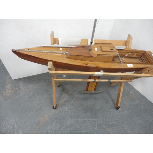 187 - Large scratch-built wooden pond yacht on a pine cradle stand.