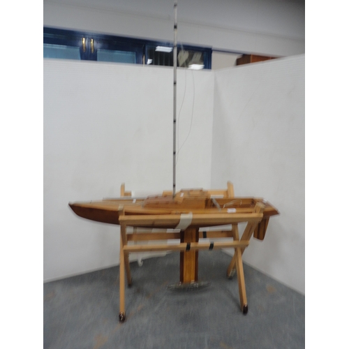 187 - Large scratch-built wooden pond yacht on a pine cradle stand.