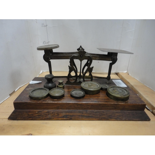 191 - Set of oak and brass postal scales with weights.