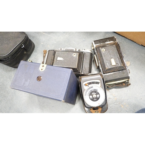 225 - Two cartons containing a large quantity of cameras and accessories to include a Yashica MG1, Praktic... 