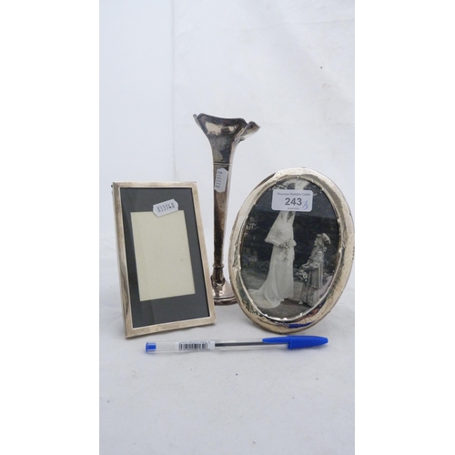 243 - Two silver-mounted photograph frames and a silver bud vase with loaded base.