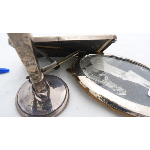 243 - Two silver-mounted photograph frames and a silver bud vase with loaded base.