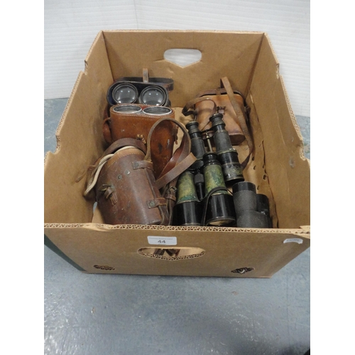 44 - Carton containing seven pairs of military-style field glasses, to include four cased sets. &nbs... 