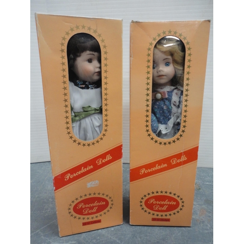49 - Carton containing boxed porcelain dolls, Russian-type doll, contemporary dragon figures etc.