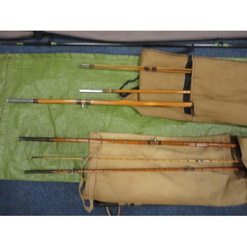 5 - Fishing equipment and accessories to include three rods in canvas carry cases, two fishing rods in t... 